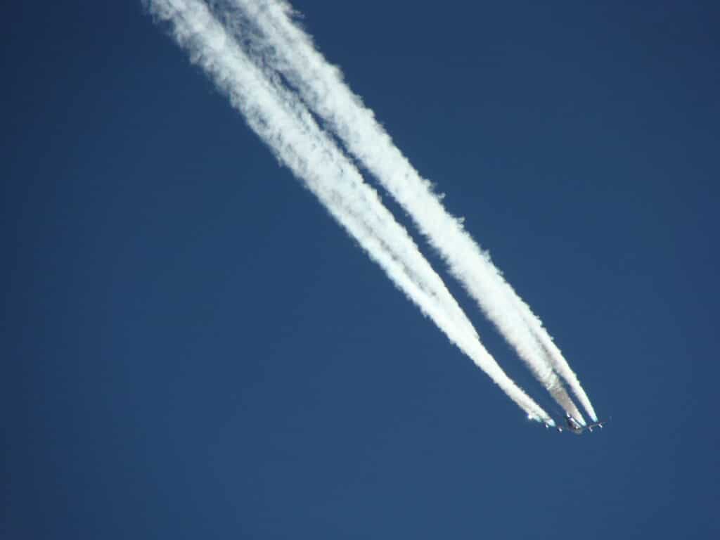 Contrails against blue sky