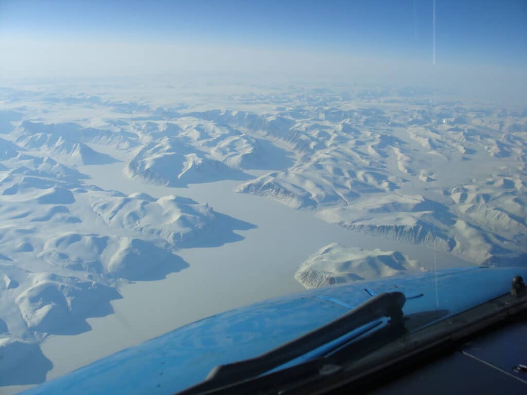 Snowy Greenland from cockpit