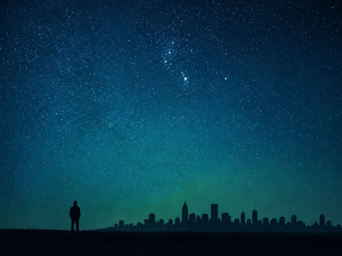 A lone silhouette standing apart from a city skyline beneath a star-filled sky