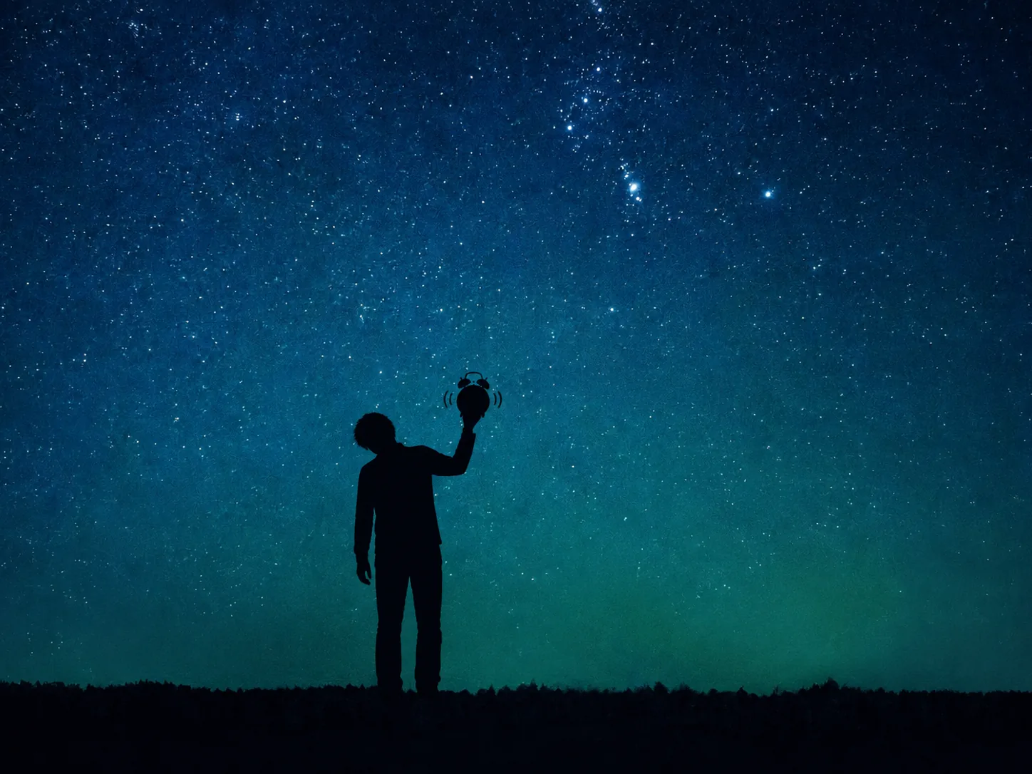 A silhouette holding up a ringing alarm clock beneath a star-filled sky